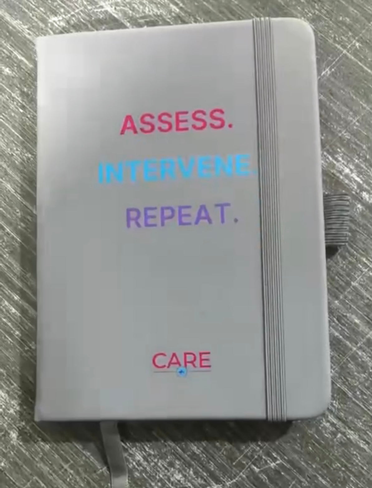 Assess, Intervene, Repeat. Medical Pocket Notebook with Care Pen